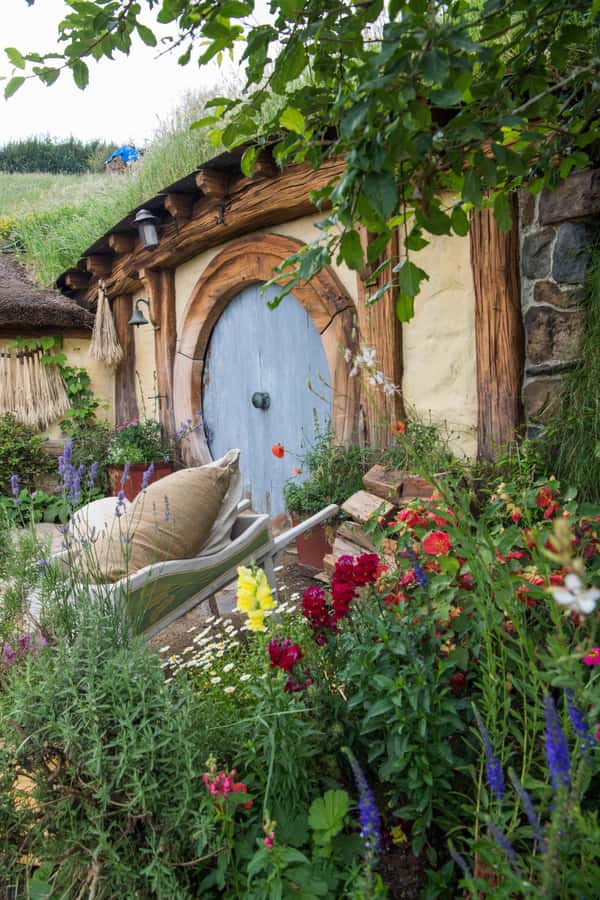 From Auckland: Guided Hobbiton Movie Set Small Group Tour - Walking Through the 12-Acre Hobbiton Set